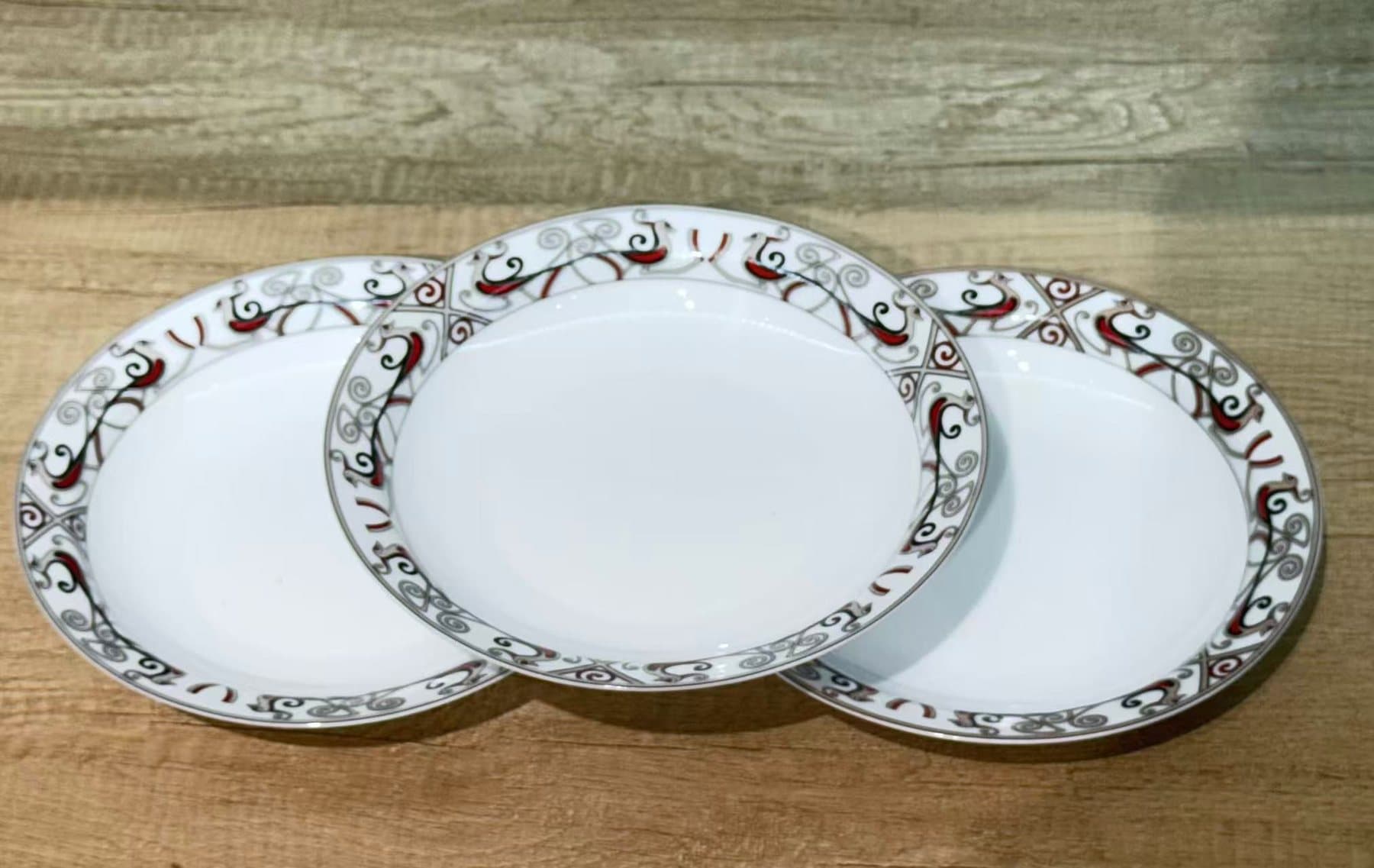 The Meadow Floral six-piece rice set — six deep plates in the gift box